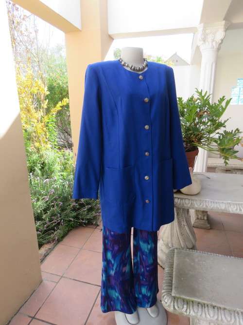Beautiful structured long sleeve royal blue button down jacket.Collarless.By SEGAL.Size 42/18.As new