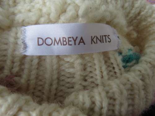 Bulky knit cream DOMBEYA  KNIT button down cardigan with red/pink flowers.Size 46/22.