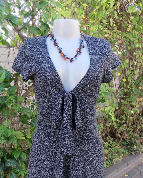 Feather light monochrome 100% stretch nylon low V dress. FINNIGANS size 38/14.Capped sleeves.As new
