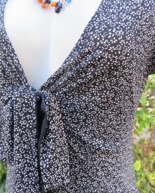 Feather light monochrome 100% stretch nylon low V dress. FINNIGANS size 38/14.Capped sleeves.As new
