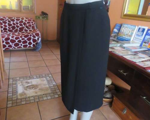 Top of the line black cross over fully lined honeycomb polyester size 38 skirt by WOOLWORTHS.As new