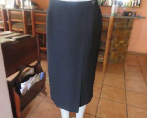 Top of the line black cross over fully lined honeycomb polyester size 38 skirt by WOOLWORTHS.As new
