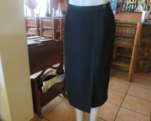 Top of the line black cross over fully lined honeycomb polyester size 38 skirt by WOOLWORTHS.As new