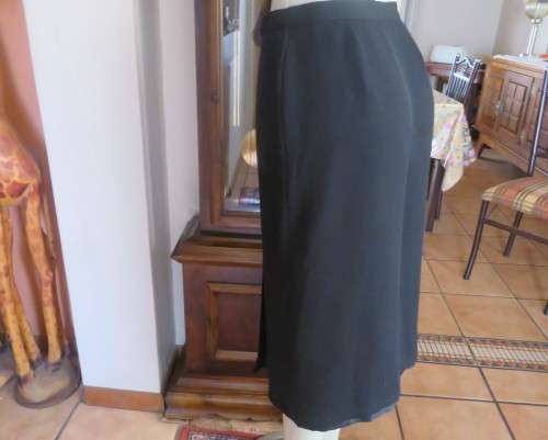 Top of the line black cross over fully lined honeycomb polyester size 38 skirt by WOOLWORTHS.As new