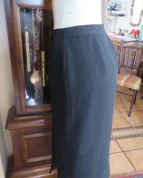 Top of the line black cross over fully lined honeycomb polyester size 38 skirt by WOOLWORTHS.As new
