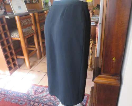 Top of the line black cross over fully lined honeycomb polyester size 38 skirt by WOOLWORTHS.As new