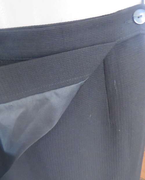 Top of the line black cross over fully lined honeycomb polyester size 38 skirt by WOOLWORTHS.As new