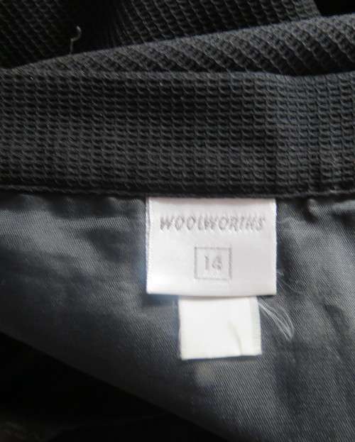Top of the line black cross over fully lined honeycomb polyester size 38 skirt by WOOLWORTHS.As new