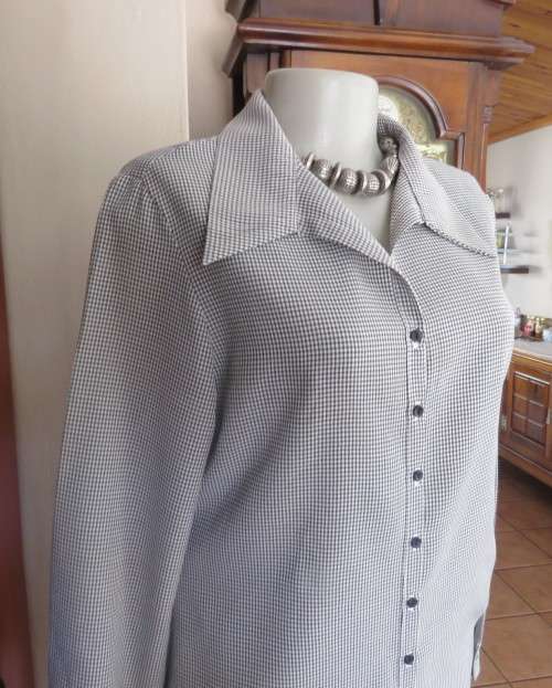 Practical black and white check long sleeve shirt. Button down with open collar. Size 34/10.As new