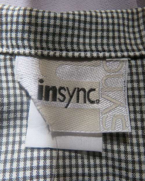 Practical black and white check long sleeve shirt. Button down with open collar. Size 34/10.As new