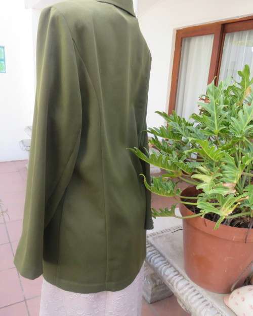 Fabulous olive green long sleeve jacket with hidden button down front.By MILADY`S size 38/14.As new