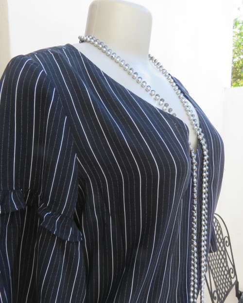 Adorable black/white vertical striped viscose top.V neck.Frilled sleeves.Size 32/8 by EDITION.As new