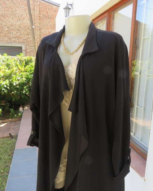 Stunning long black waterfall style loose hanging jacket.Spotless.As new.Bracelet sleeves.Size 42/18