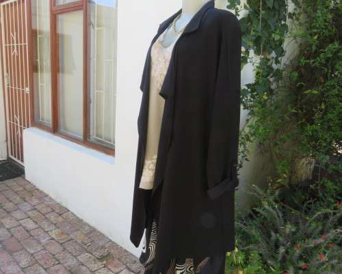 Stunning long black waterfall style loose hanging jacket.Spotless.As new.Bracelet sleeves.Size 42/18