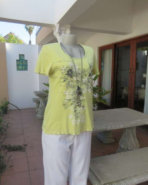 Lemon colour short sleeve 100% cotton slip over T Shirt with Black/white floral front.Size 34/10.