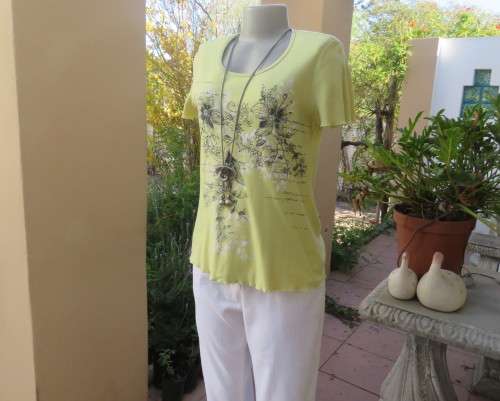 Lemon colour short sleeve 100% cotton slip over T Shirt with Black/white floral front.Size 34/10.