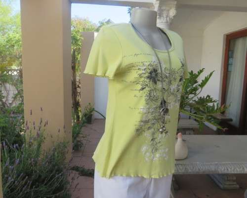 Lemon colour short sleeve 100% cotton slip over T Shirt with Black/white floral front.Size 34/10.