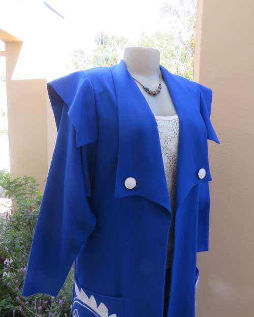 Stunning ensemble in royal blue cotton.Kick out skirt with long open embroidered coat size 34.As new