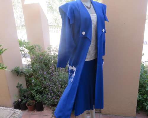Stunning ensemble in royal blue cotton.Kick out skirt with long open embroidered coat size 34.As new