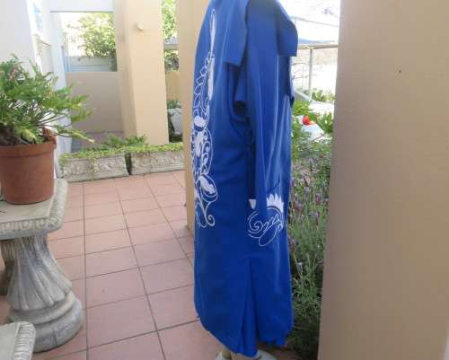 Stunning ensemble in royal blue cotton.Kick out skirt with long open embroidered coat size 34.As new