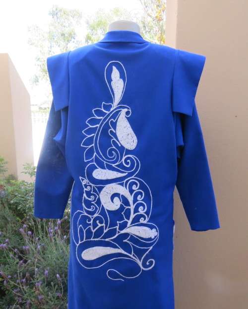 Stunning ensemble in royal blue cotton.Kick out skirt with long open embroidered coat size 34.As new