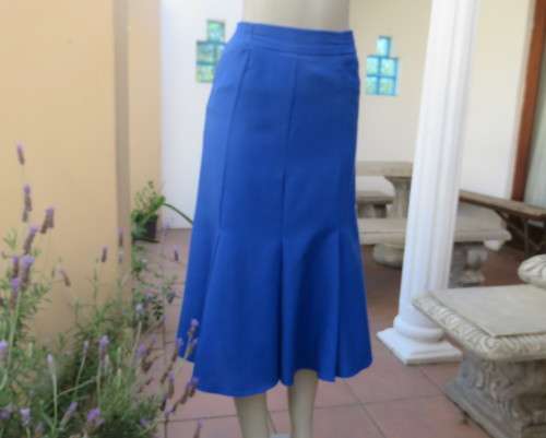Stunning ensemble in royal blue cotton.Kick out skirt with long open embroidered coat size 34.As new