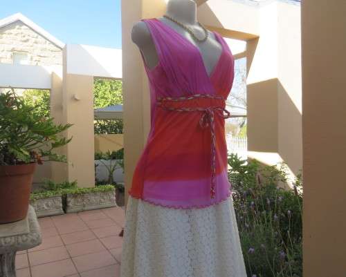 Super sexy cross over top in sheer pink/crimson fabric.Braiding with gold in waist.Size 36.By OASIS.