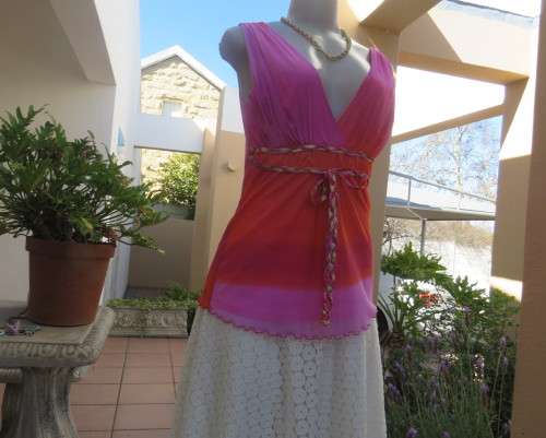 Super sexy cross over top in sheer pink/crimson fabric.Braiding with gold in waist.Size 36.By OASIS.