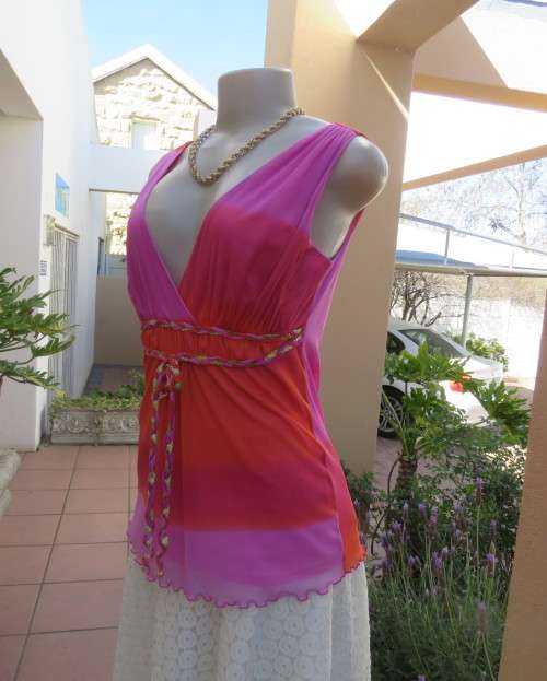 Super sexy cross over top in sheer pink/crimson fabric.Braiding with gold in waist.Size 36.By OASIS.