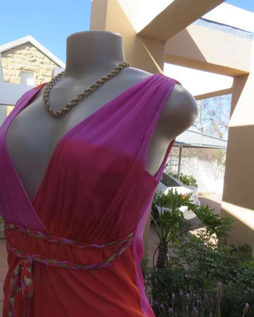 Super sexy cross over top in sheer pink/crimson fabric.Braiding with gold in waist.Size 36.By OASIS.