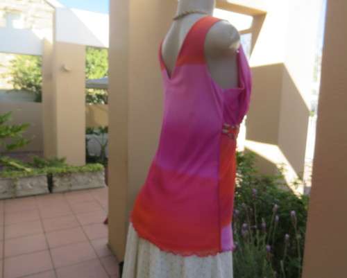 Super sexy cross over top in sheer pink/crimson fabric.Braiding with gold in waist.Size 36.By OASIS.