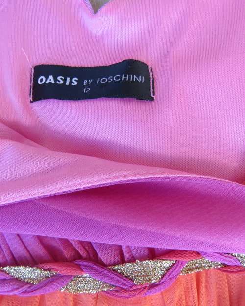 Super sexy cross over top in sheer pink/crimson fabric.Braiding with gold in waist.Size 36.By OASIS.