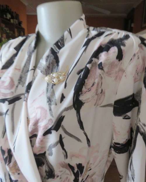 Amazing cross over high neck white/pink/grey floral long sleeve top.Size 42/18 By MILADY`S. As new.