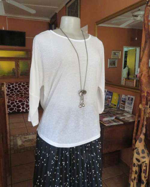 Light as a feather soft white slip over top in poly/viscose.Dolman sleeves.Size 38/14 by WOOLWORTHS.