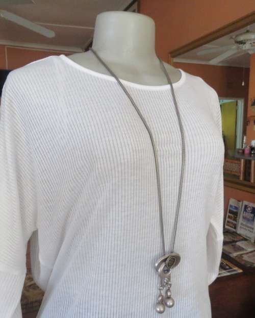Light as a feather soft white slip over top in poly/viscose.Dolman sleeves.Size 38/14 by WOOLWORTHS.