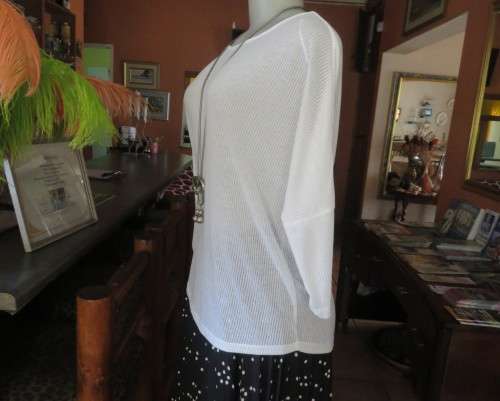 Light as a feather soft white slip over top in poly/viscose.Dolman sleeves.Size 38/14 by WOOLWORTHS.
