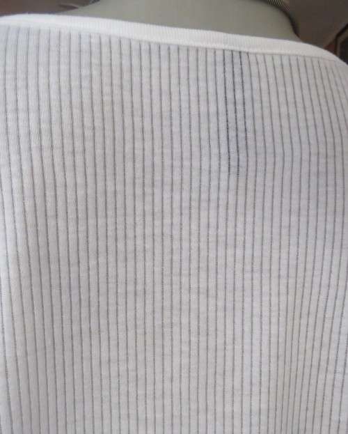Light as a feather soft white slip over top in poly/viscose.Dolman sleeves.Size 38/14 by WOOLWORTHS.