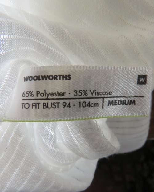 Light as a feather soft white slip over top in poly/viscose.Dolman sleeves.Size 38/14 by WOOLWORTHS.