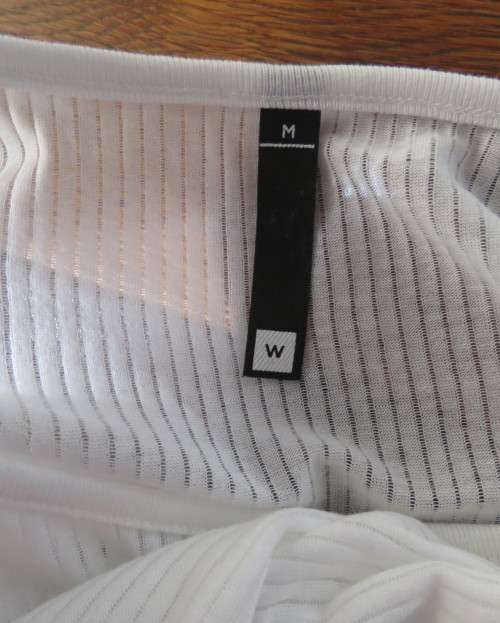 Light as a feather soft white slip over top in poly/viscose.Dolman sleeves.Size 38/14 by WOOLWORTHS.