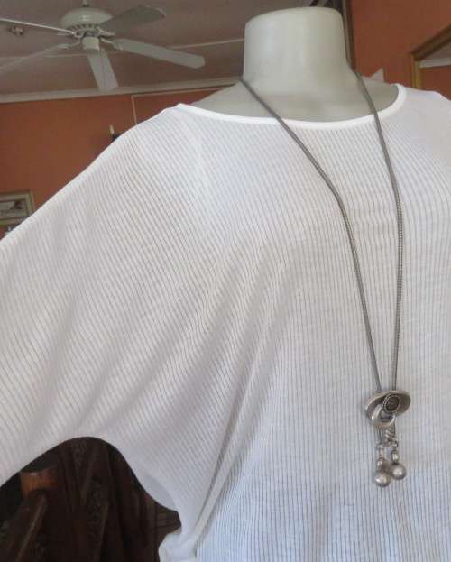 Light as a feather soft white slip over top in poly/viscose.Dolman sleeves.Size 38/14 by WOOLWORTHS.