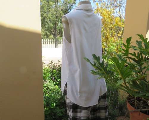 Snow white sleeveless summer top.Button down with shirt collar.By WOOLWORTHS size 38/14.As new.