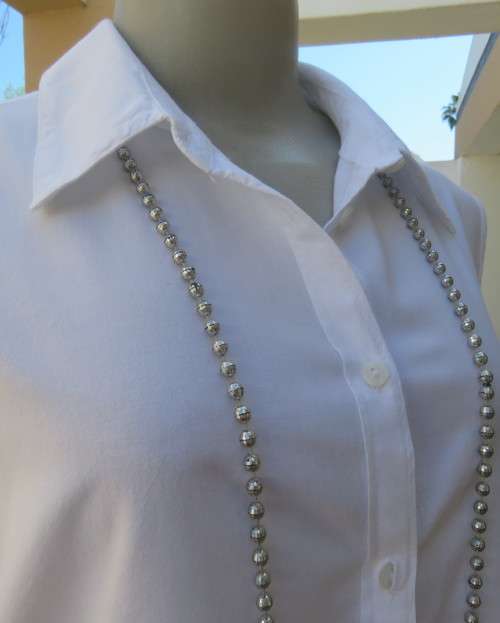 Snow white sleeveless summer top.Button down with shirt collar.By WOOLWORTHS size 38/14.As new.