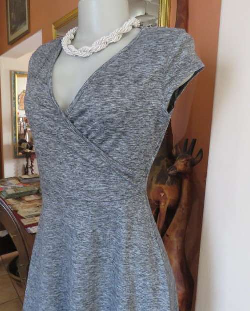 Sweet black/white mottled stretch polyester dress with capped sleeves.Fold over top.Size 34.As new