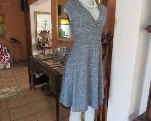 Sweet black/white mottled stretch polyester dress with capped sleeves.Fold over top.Size 34.As new