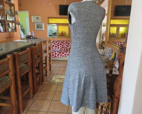 Sweet black/white mottled stretch polyester dress with capped sleeves.Fold over top.Size 34.As new
