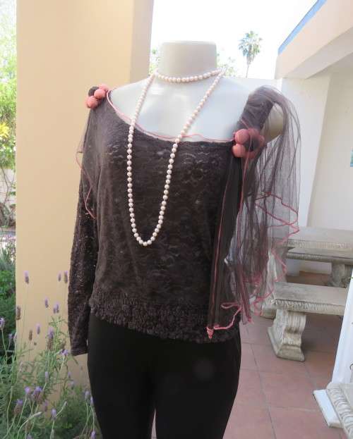 Glamour soot black stetch lace with netting overlay top.One sleeve/one strap.Size 38 by RIMODA.