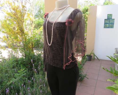 Glamour soot black stetch lace with netting overlay top.One sleeve/one strap.Size 38 by RIMODA.