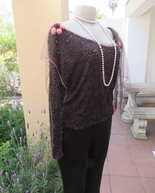 Glamour soot black stetch lace with netting overlay top.One sleeve/one strap.Size 38 by RIMODA.