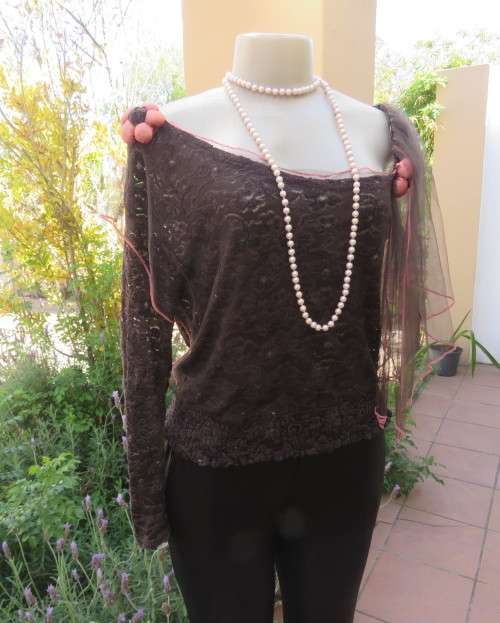 Glamour soot black stetch lace with netting overlay top.One sleeve/one strap.Size 38 by RIMODA.