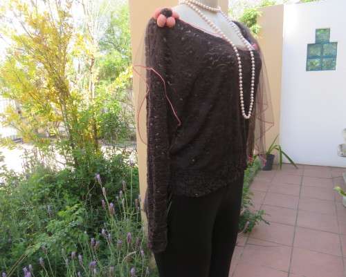 Glamour soot black stetch lace with netting overlay top.One sleeve/one strap.Size 38 by RIMODA.